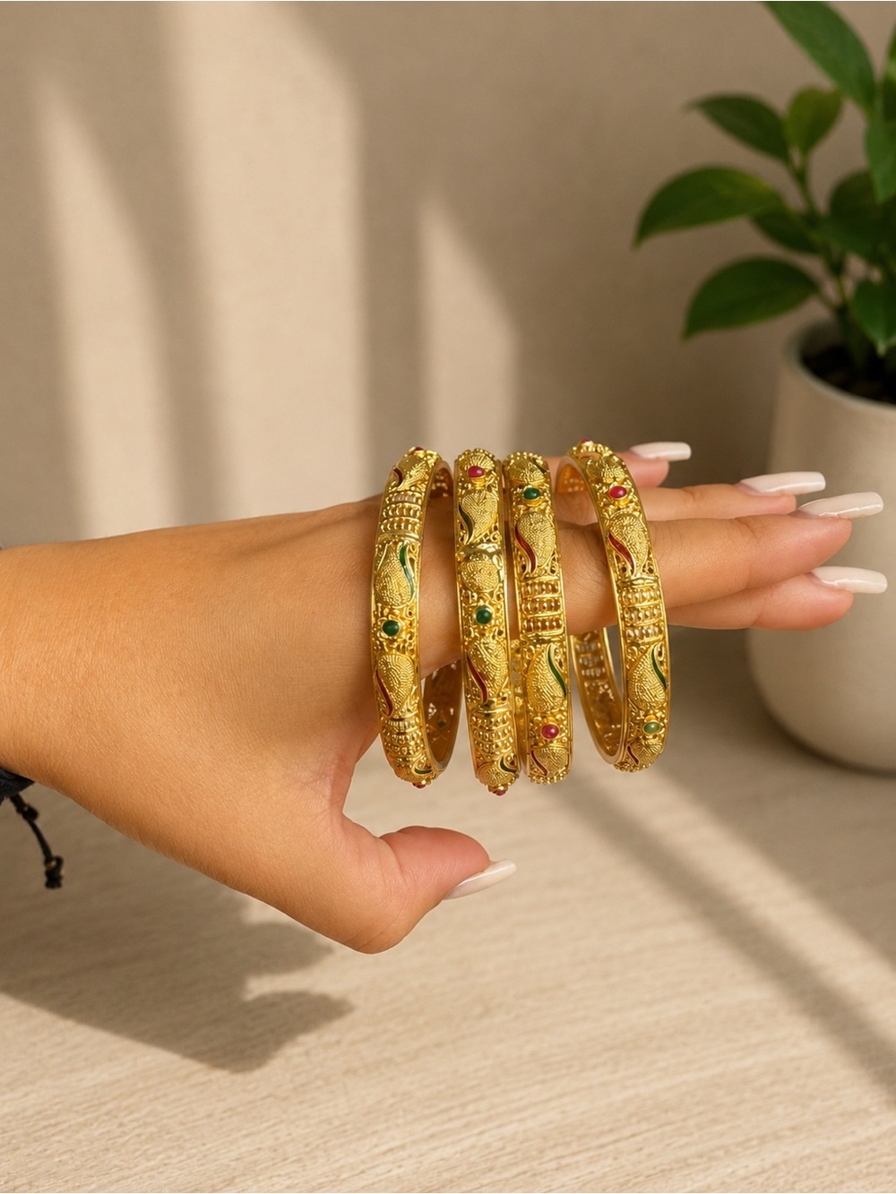 Touchstone Crystal Gold Tone Bangles with Green & Red Crystal Accents